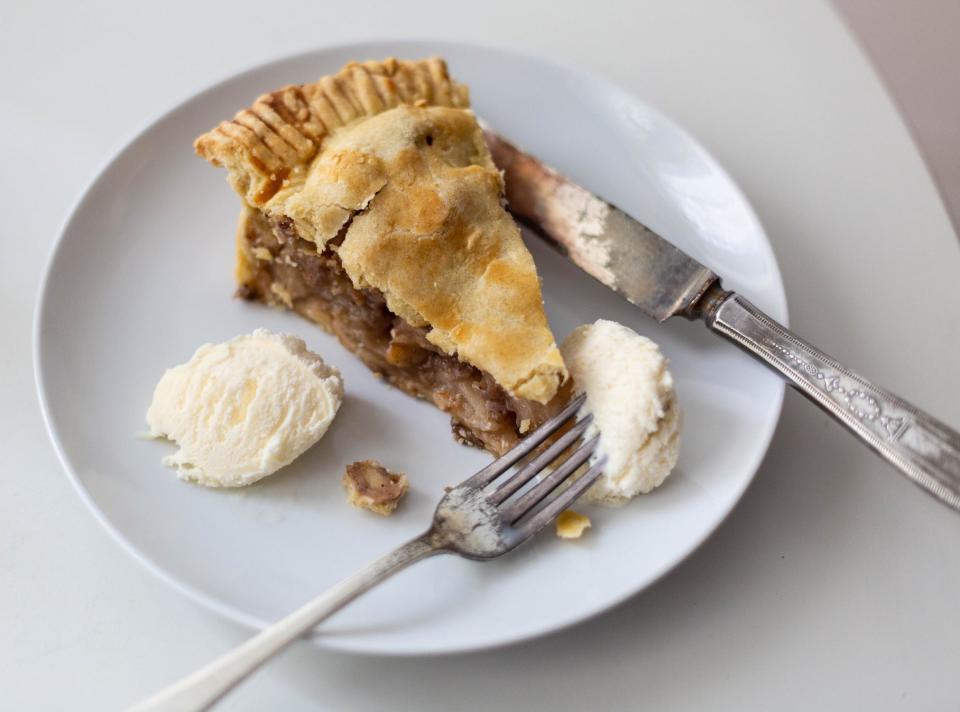 A slice of pie with ice cream