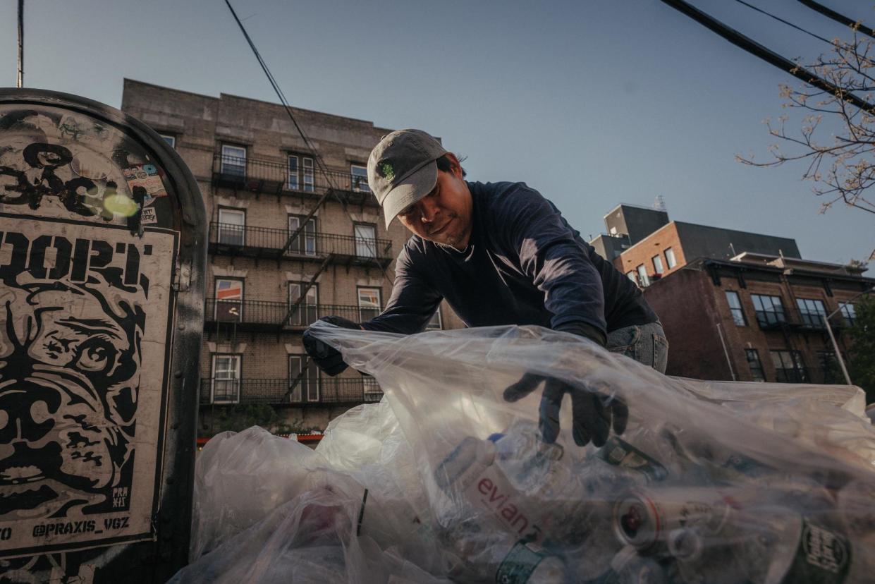 <span>Pedro Romero, 53, from Puebla, Mexico, collects cans and bottles for recycling in North Brooklyn on a recent evening in Brooklyn, New York. He works seven days a week to earn a living.</span><span>Photograph: Thalia Juarez/The Guardian</span>