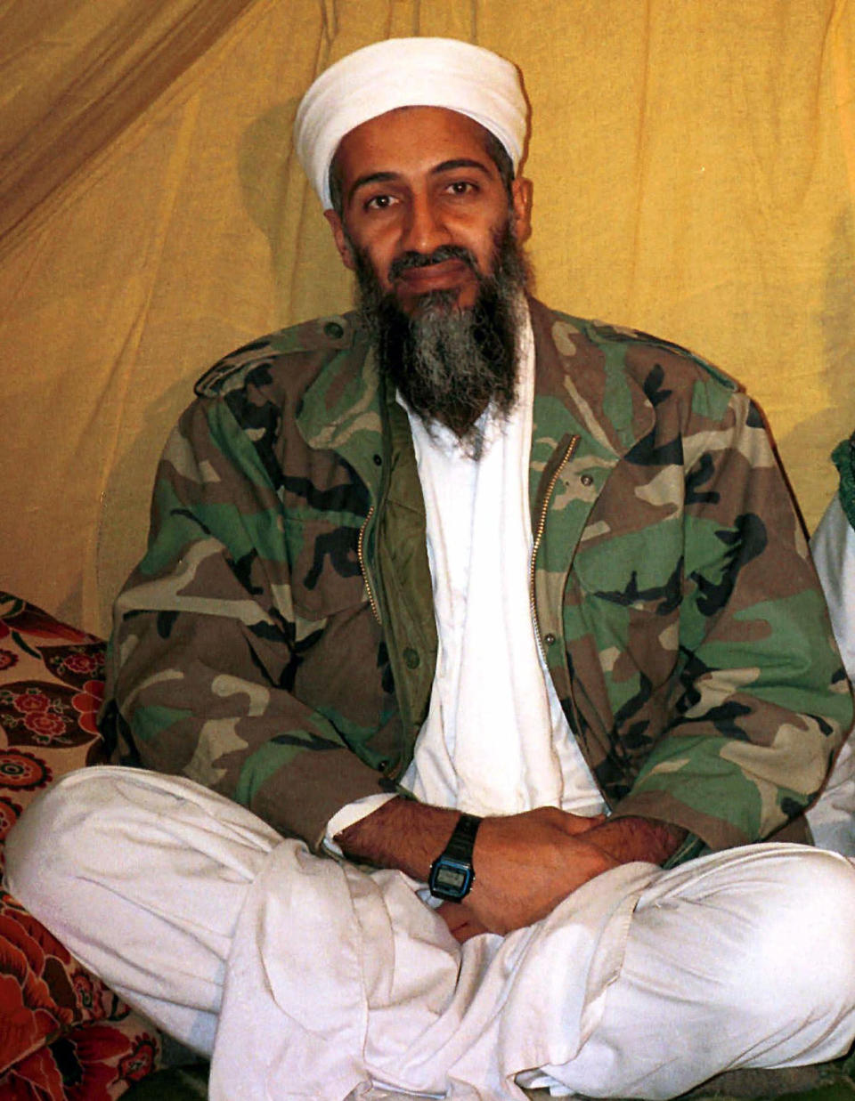 This undated file photo shows al Qaida leader Osama bin Laden, in Afghanistan. A firsthand account of the Navy SEAL raid that killed Osama bin Laden contradicts previous accounts by administration officials, raising questions as to whether the terror mastermind presented a clear threat when SEALs first fired upon him. (AP Photo)