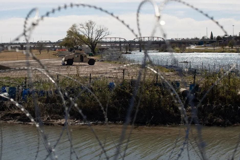 Texas National Guard troops patrol Shelby Park at the Texas-Mexico border in Eagle Pass, on Friday.