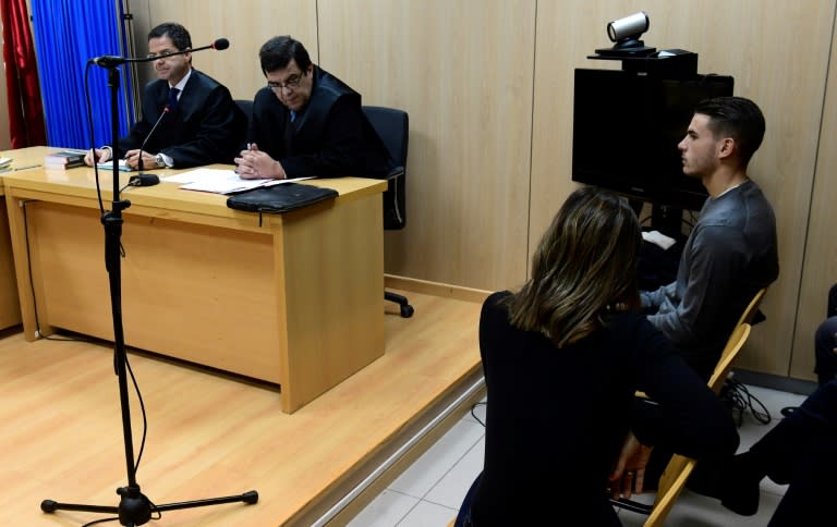 Atletico Madrid's French defender Lucas Hernandez (R) sits at the courtroom of the Madrid's Criminal Court Nr. 35, which specialises in domestic violence, beside his girlfriend in Madrid on February 21, 2017