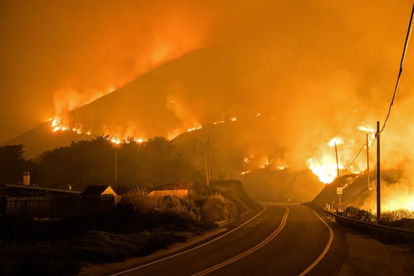 The Colorado Fire burns along Highway 1 near Big Sur, Calif., Saturday, Jan. 22, 2022. (AP Photo/Nic Coury)