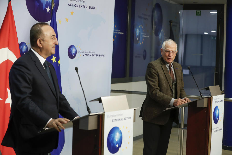 European Union foreign policy chief Josep Borrell, right, and Turkey's Foreign Minister Mevlut Cavusoglu give a joint statement prior to their meeting in Brussels, Thursday, Jan. 21, 2021. (Stephanie Lecocq/Pool Photo via AP)