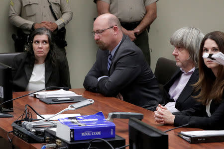 FILE PHOTO: David Turpin (2nd R) and Louise Turpin (L) appear in court for their arraignment in Riverside, California U.S. January 18, 2018. REUTERS/Gina Ferazzi/Pool/File Photo