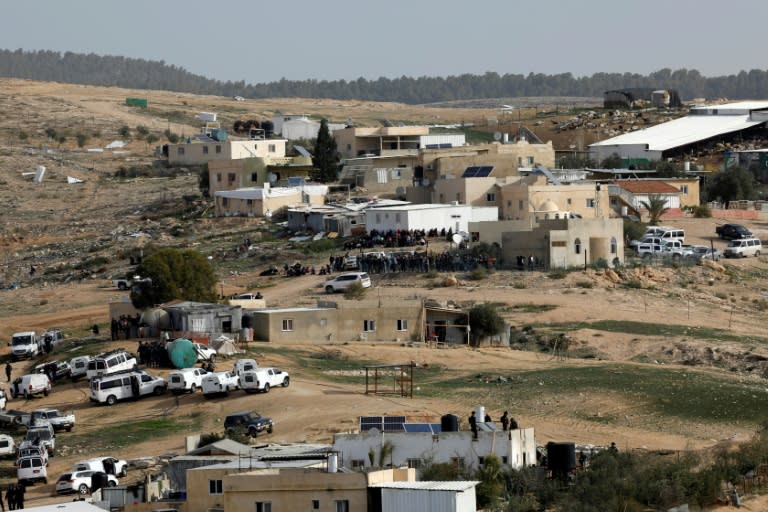 Israeli police (foreground) gather in the Bedouin village of Umm al-Heiran, which is not recognized by the Israeli government, on January 18, 2017