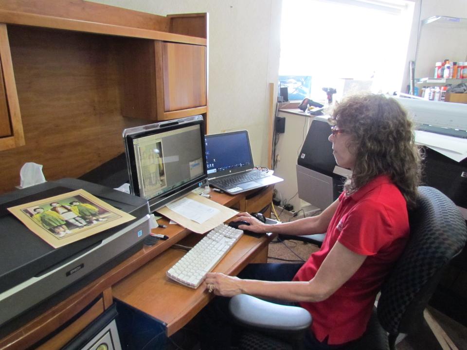 Rita Ernest doing a reproduction of a customer's photo on Sept. 7, 2023. Ernest Camera Shoppe provided many photo services including photo restoration and reproduction.