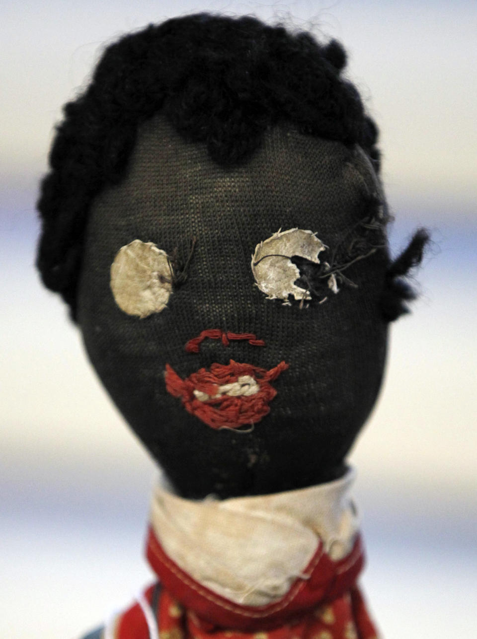 In this Wednesday, July 25, 2012 photo, an historic black cloth doll appears on display in New Orleans. Amid rare antique dolls crafted in porcelain, whimsical Kewpies and homage to contemporary icon Barbie, cloth dolls in the image of African-Americans drew special attention as more than 1,200 collectors gathered in New Orleans for the annual convention of the United Federation of Doll Clubs. (AP Photo/Gerald Herbert)