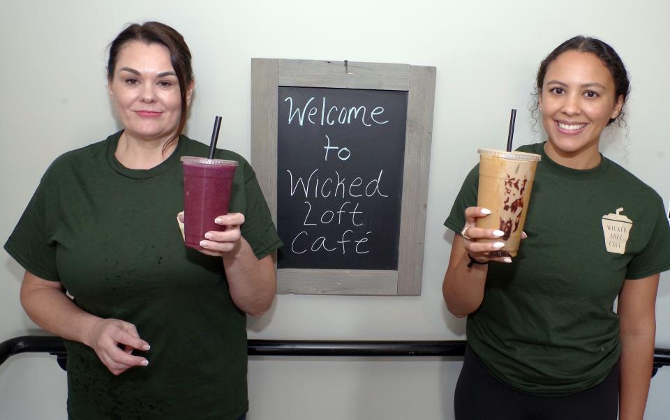 Cathy Mitchell (R) stands with her mother Jenn Mitchell in her new restaurant called Wicked Loft Cafe in downtown Whitman on Wednesday, August 31, 2022. Cathy recently started her new business, taking over from a previous owner of the space and completely refurbishing the interior. Cathy's mom Jenn quit a job she had for 21 years to help her and work with her daughter.