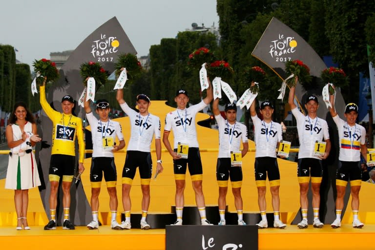 Riders of the Great Britain's Sky cycling team (From L) Christopher Froome, Michal Kwiatkowski, Luke Rowe, Christian Knees, Mikel Landa, Mikel Nieve, Vasil Kiryienka, Sergio Henao celebrate their best team award