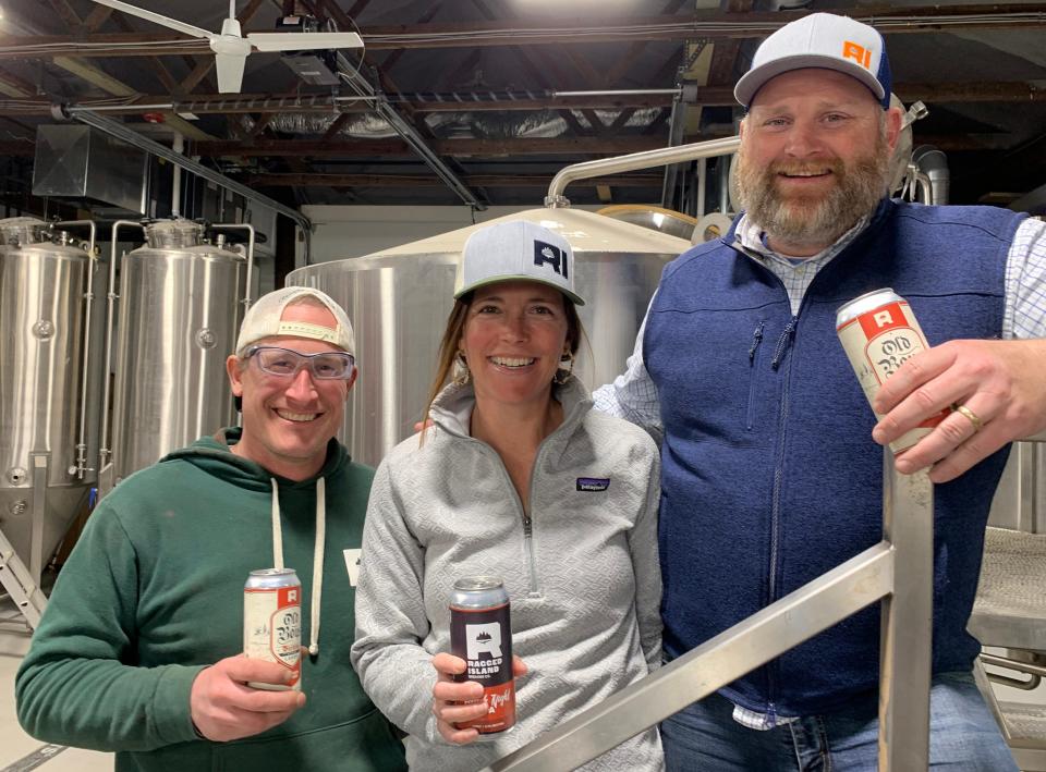 Ragged Island Brewing co-owners Katie and Matt Gray stand with new head brewer Derek Luke.