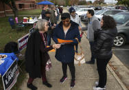 Audrey Garnett, center, is greeted by candidates and campaign volunteers outside Smith Station Elementary School on Election Day in Spotsylvania, Va., Tuesday, Nov. 5, 2019. (Mike Morones/The Free Lance-Star via AP)