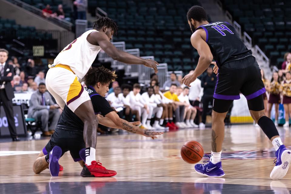 Mar 10, 2023; Atlantic City, NJ, USA; Iona Gaels forward Nelly Junior Joseph (13) competes for the ball with Niagara Purple Eagles guard Braxton Bayless (4) during the first half at Jim Whelan Boardwalk Hall. Mandatory Credit: John Jones-USA TODAY Sports