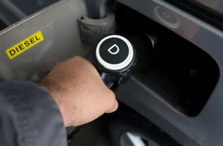 FILE PHOTO: A man fills up his car with diesel at a petrol station in Madrid, Spain, May 29, 2018. REUTERS/Sergio Perez