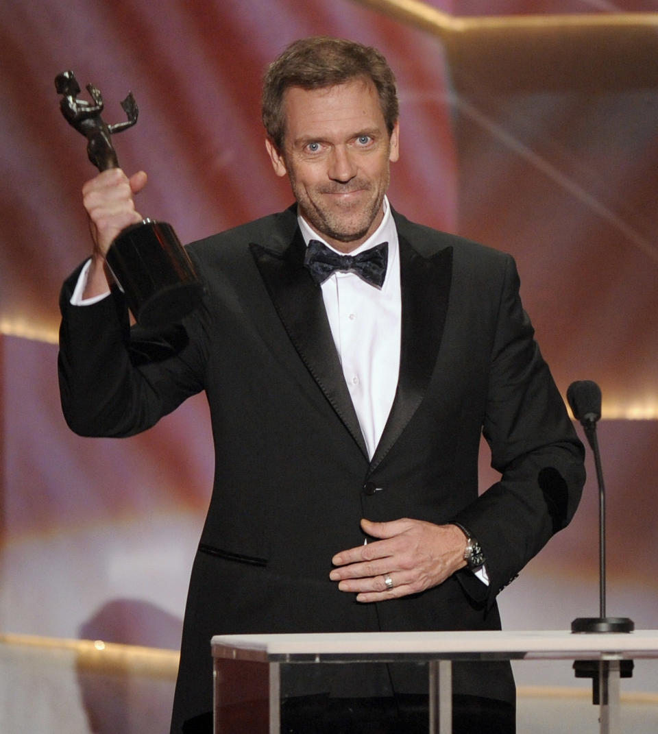 FILE - In this Jan. 25, 2009 file photo, actor Hugh Laurie accepts the award for outstanding performance by a male actor in a drama series for "House" at the 15th Annual Screen Actors Guild in Los Angeles. The Fox medical drama concludes its eight-season run on Monday, May 21, 2012, with a finale at 9 p.m. EDT, preceded by a one-hour retrospective. (AP Photo/Mark J. Terrill, file)