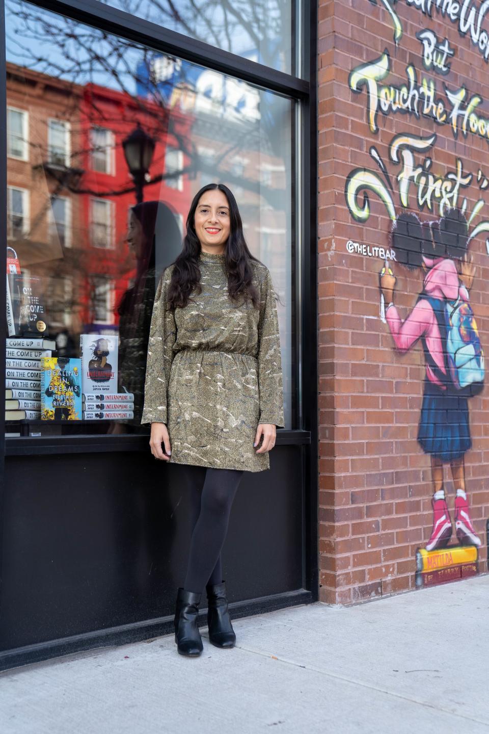 Author Lilliam Rivera in front of the Bronx's Lit Bar.