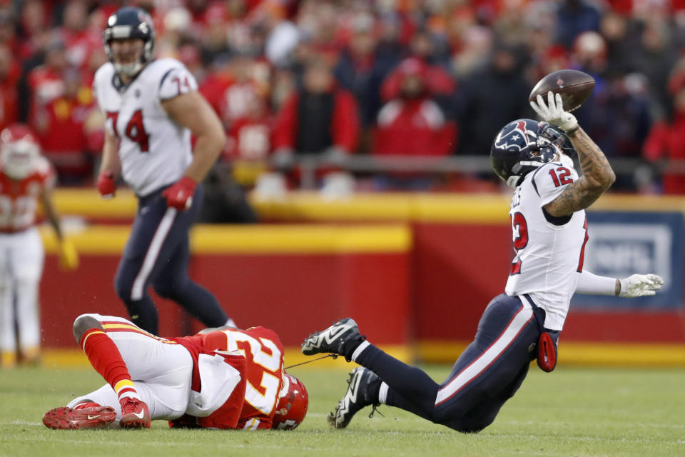 Houston Texans wide receiver Kenny Stills (12) is tripped up by Kansas City Chiefs cornerback Rashad Fenton (27) during a reverse play in the second half of an NFL divisional playoff football game, in Kansas City, Mo., Sunday, Jan. 12, 2020. (AP Photo/Jeff Roberson)