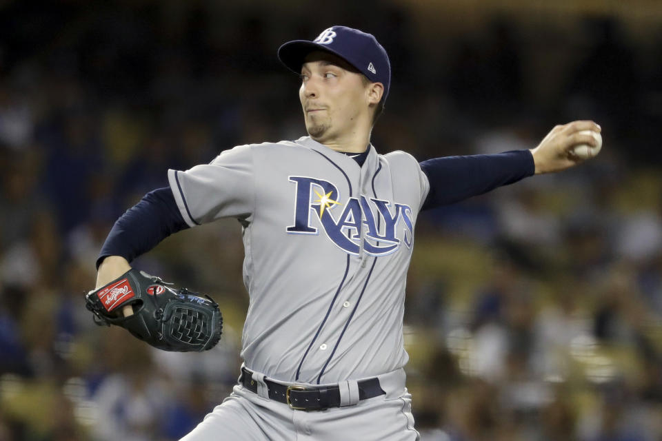 FILE - In this Sept. 17, 2019, file photo, Tampa Bay Rays starting pitcher Blake Snell throws to a Los Angeles Dodgers batter during the first inning of a baseball game in Los Angeles. Rays All-Star pitcher Blake Snell says he will not take the mound this year if his pay is cut further, proclaiming: “I’m not playing unless I get mine.” the 2018 AL Cy Young Award winner said on a Twitch stream Wednesday, May 14 2020. (AP Photo/Chris Carlson, File)