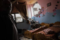 A children's room is severely damaged in a building neighboring the home of Ramez al-Masri that was destroyed by an air-strike prior to a cease-fire reached after an 11-day war between Gaza's Hamas rulers and Israel, Sunday, May 23, 2021, in Beit Hanoun, the northern Gaza Strip. (AP Photo/John Minchillo)