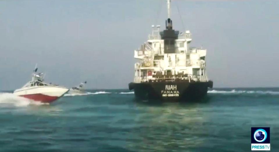 The Panamanian-flagged tanker MT Riah surrounded by the Iranian Revolutionary Guard. (AP)