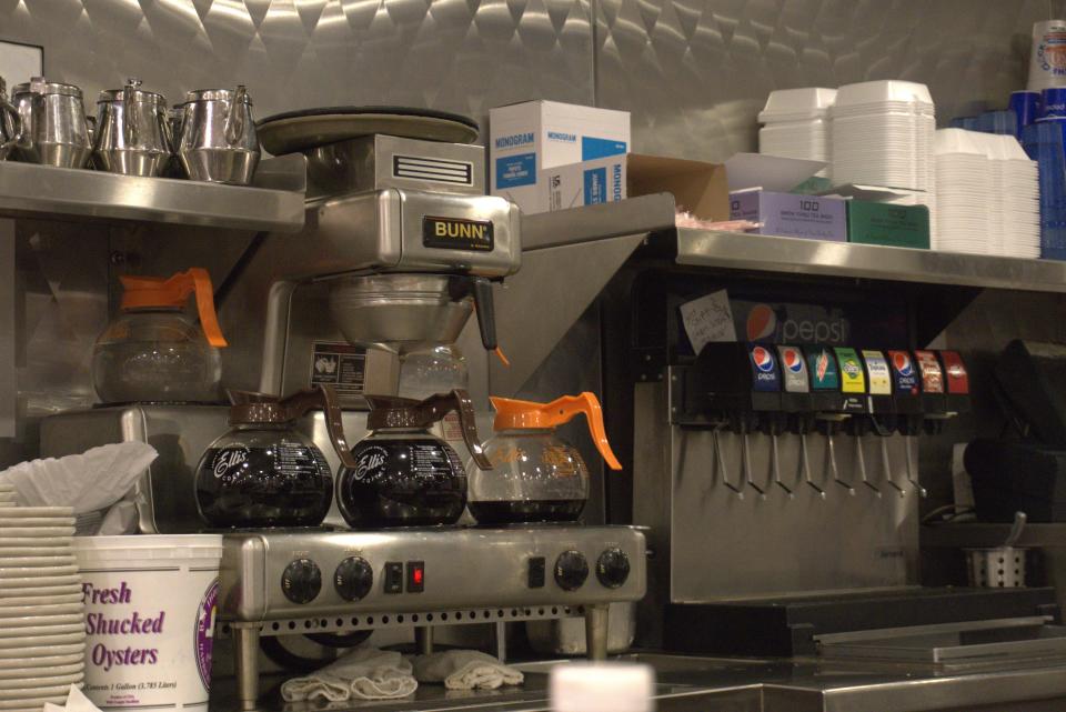 Freshly brewed decaf and regular coffee stay warm on the stove before being enjoyed by patrons at Round the Clock Diner in York.