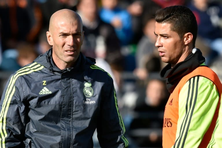 Real Madrid's new head coach Zinedine Zidane (L) talks to Cristiano Ronaldo during his first team training session, at the Alfredo di Stefano stadium in Valdebebas, on the outskirts of Madrid, on January 5, 2016