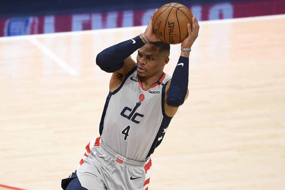 FILE - In this May 29, 2021, file photo, Washington Wizards guard Russell Westbrook works with the ball in Game 3 in a first-round NBA basketball playoff series against the Philadelphia 76ers in Washington. The Los Angeles Lakers are acquiring Westbrook from the Wizards for three players and this year's first-round draft pick.According to two people with knowledge of the deal, the Lakers are trading Kyle Kuzma, Kentavious Caldwell-Pope and Montrezl Harrell to Washington for Westbrook. (AP Photo/Nick Wass, File)