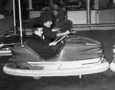 <p>Elizabeth and her son Michael are seen playing bumper cars at the circus in 1961. </p>