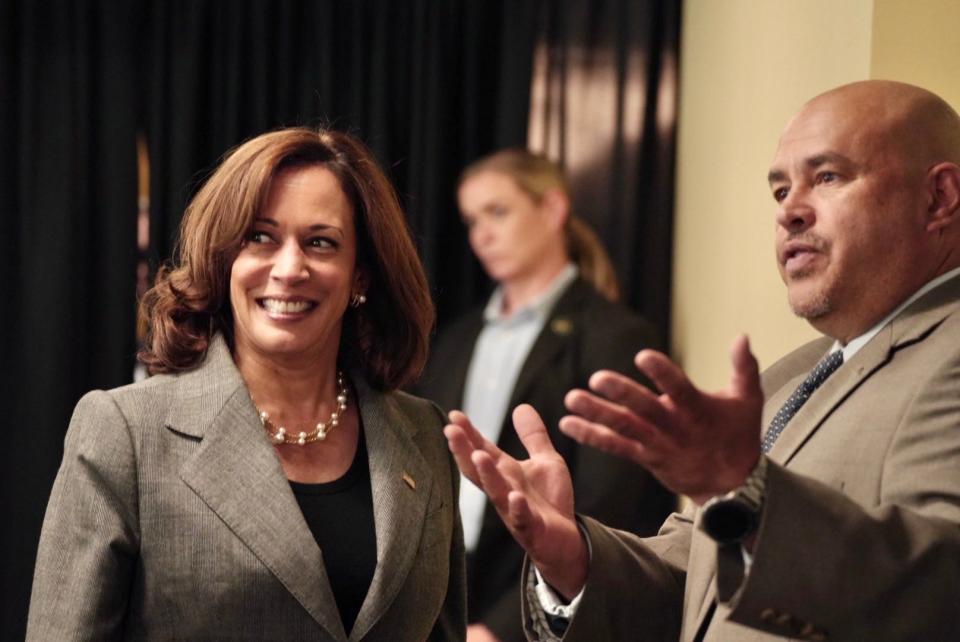 Milwaukee Common Council President Jose Perez lets Vice President Kamala Harris know that local Latino leaders are looking forward to speak with her during Harris' visit to Milwaukee on Sept. 22.