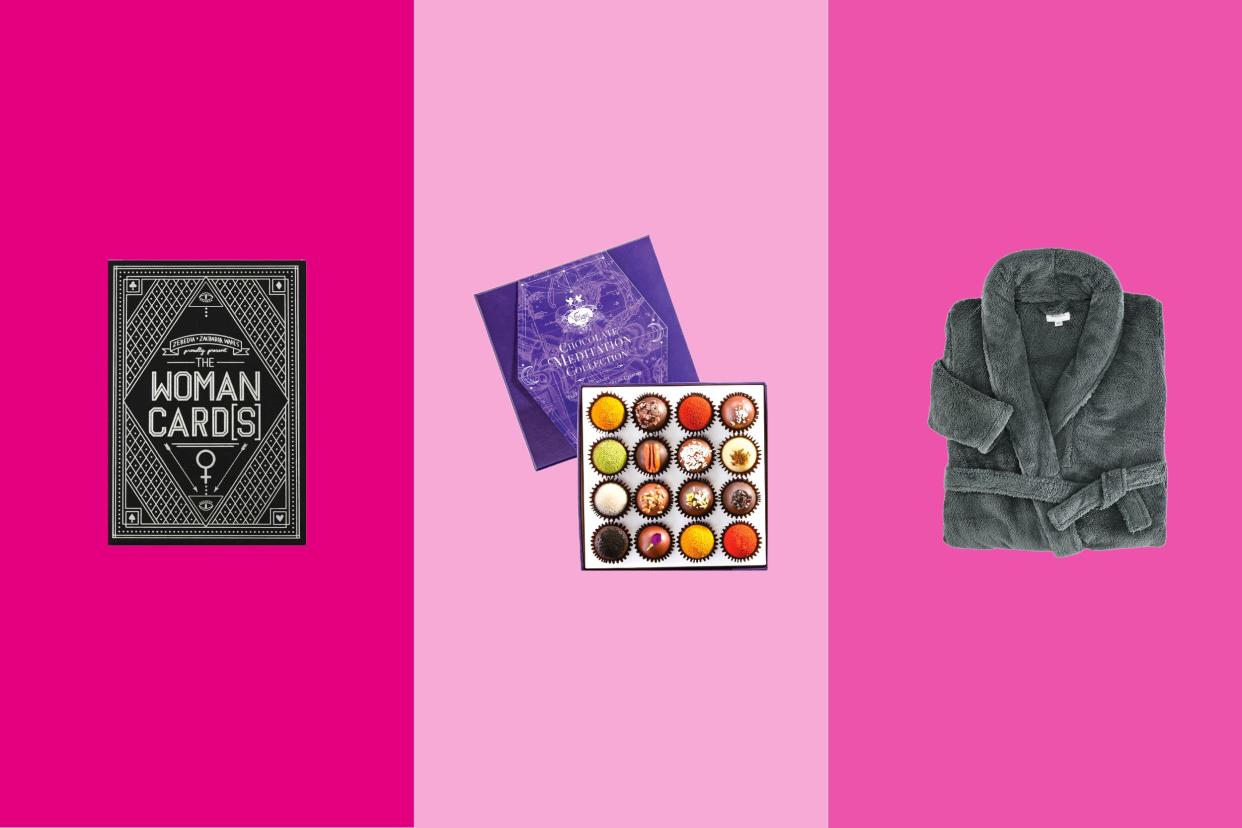 Three gift items on tri-toned magenta pink hues, Woman Cards, a box of Vosges Haut-Chocolat chocolates, and a Gravity robe