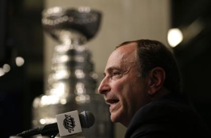 NHL commish Gary Bettman says man-games lost head injuries decreased probably about half in 2013-14 compared to last season. (AP)