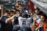 San Francisco Giants' Casey Schmitt (6) is congratulated for his two-run home run against the Arizona Diamondbacks during the second inning of a baseball game Thursday, May 11, 2023, in Phoenix. (AP Photo/Chris Coduto)