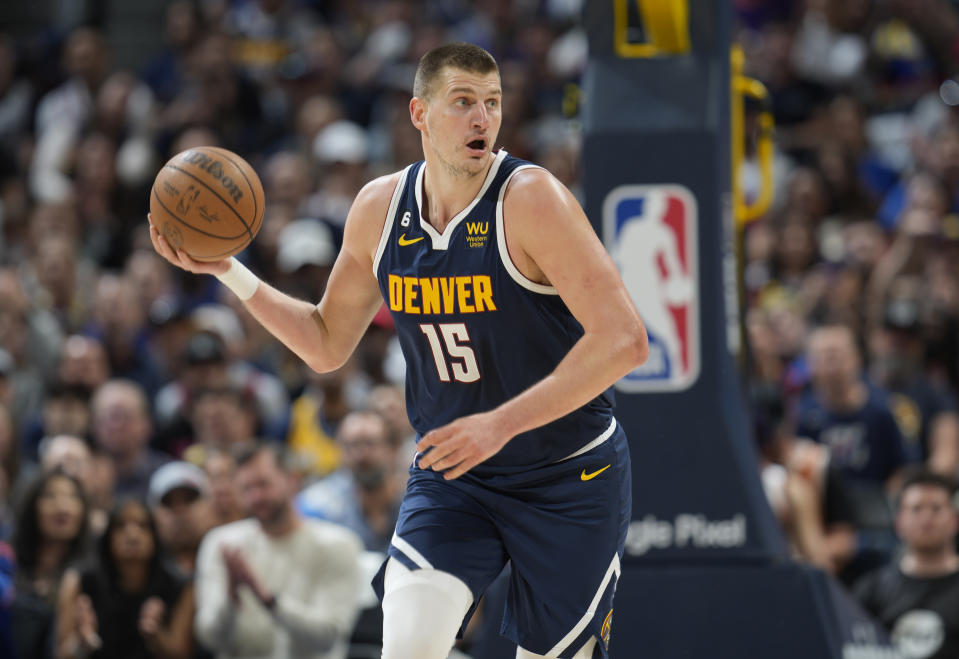 Denver Nuggets center Nikola Jokic picks up the ball in the first half of Game 2 of an NBA second-round playoff series against the Phoenix Suns, Monday, May 1, 2023, in Denver. (AP Photo/David Zalubowski)