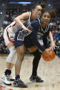 Georgetown's Kennedy Fauntleroy, right, is pressured by UConn's Nika Muhl in the first half of an NCAA college basketball game, Sunday, Jan. 15, 2023, in Hartford, Conn. (AP Photo/Jessica Hill)