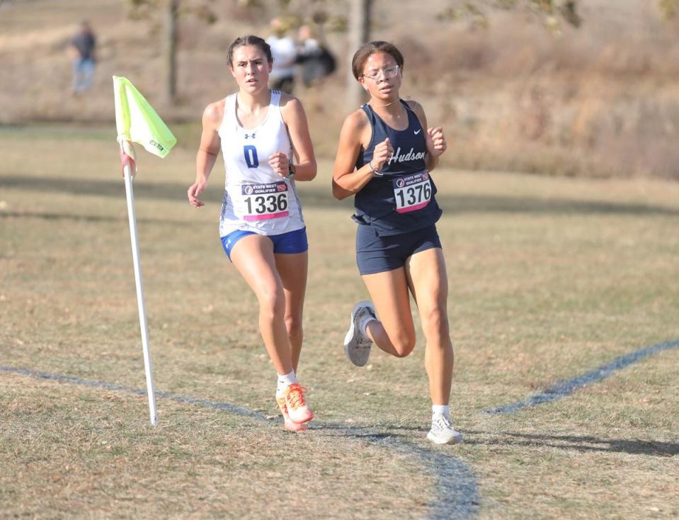 Danville’s Alaina Gourley (left)  and Hudsons Desi Lang lead the field early in the race at the Girls Cross Country Class 1A State Qualifier at Kicker Soccer Complete in Iowa City. Lang placed first followed by Gourley  to qualify for the state meet.