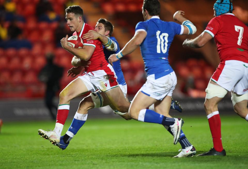 Kieran Hardy breaks to score Wales’s first try against ItalyReuters