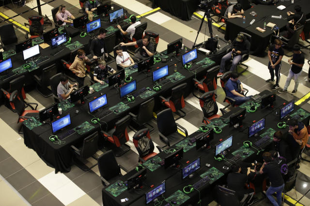 In this Thursday, Aug. 29, 2019 photo, esport (electronic sport) players participate during the qualifying rounds for the first Philippine esport team in metropolitan Manila, Philippines. Esports, a form of competition using video games, will be making its debut as a medal sport at the 30th South East Asian Games in the country which starts November this year. (AP Photo/Aaron Favila)