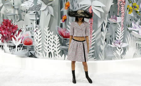 A model presents a creation by Karl Lagerfeld as part of his Haute Couture Spring Summer 2015 show for Chanel. REUTERS/Gonzalo Fuentes