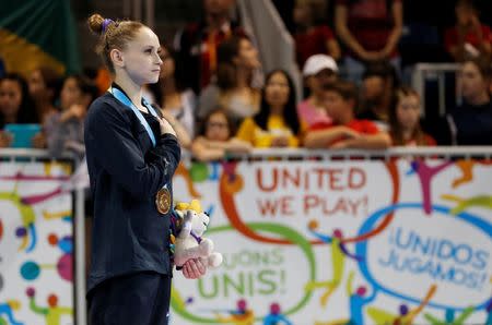 Jul 14, 2015; Toronto, Ontario, CAN; Rachel Gowey of the United States on the podium after winning the women's gymnastics uneven bars final during the 2015 Pan Am Games at Toronto Coliseum. Mandatory Credit: Jeff Swinger-USA TODAY Sports