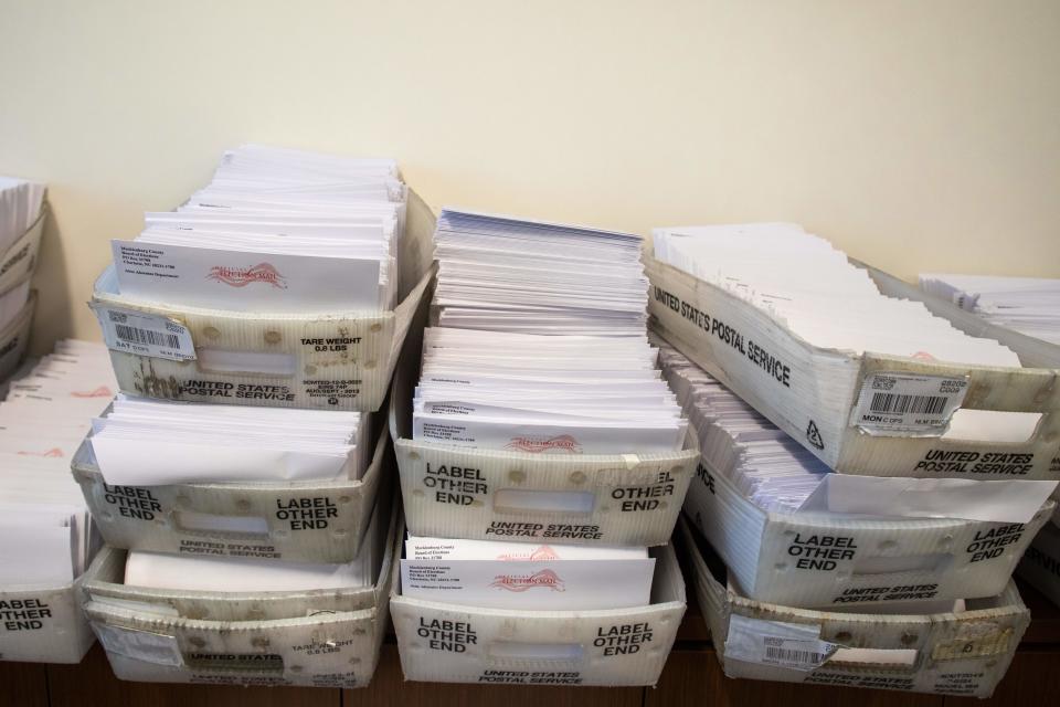 Large boxes of envelopes are seen as absentee ballot election workers stuff ballot applications at the Mecklenburg County Board of Elections office in Charlotte, North Carolina on September 4, 2020. (Logan Cyrus/AFP via Getty Images)