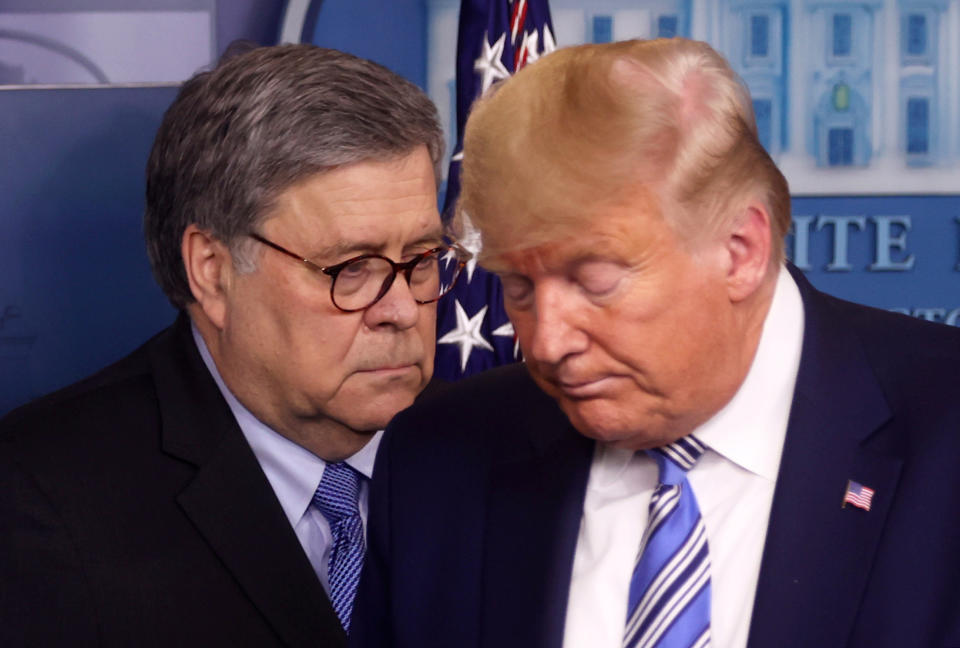 President Trump turns over the podium to U.S. Attorney General William Barr during a briefing at the White House in Washington, D.C., March 23, 2020. (Jonathan Ernst/Reuters)