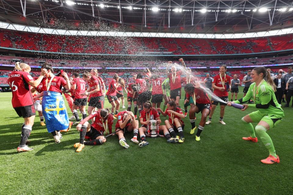 Mary Earps sprayed her teammates with champagne in celebration at their first FA Cup trophy (The FA via Getty Images)