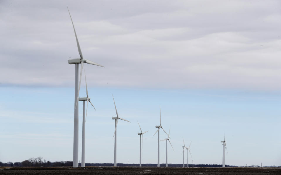 FILE - In this Friday, Feb. 2, 2018 file photo, Wind turbines stand in a field near Northwood, Iowa, USA. With global temperatures rising, superstorms taking their deadly toll and a year-end deadline to firm up the Paris climate deal, leaders at this year’s U.N. General Assembly are feeling a sense of urgency to keep up the momentum on combating climate change. (AP Photo/Charlie Neibergall, file)