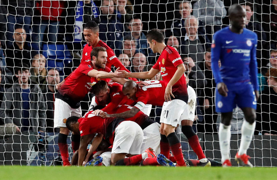 Manchester United players celebrate Paul Pogba’s goal in Monday’s 2-0 win over Chelsea. (Reuters/David Klein)