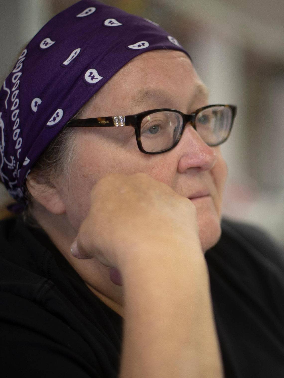 Gwen Johnson, Hemphill Community Center board chair, sits at table inside the community center in Hemphill.