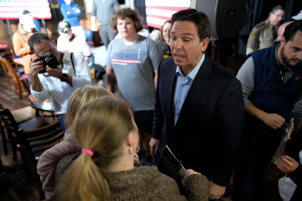 Republican presidential candidate Florida Gov. Ron DeSantis greets audience members during a meet and greet, Saturday, Oct. 14, 2023, in Creston, Iowa.