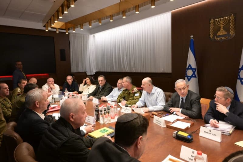 Israeli Prime Minister Benjamin Netanyahu (2nd R) speaks at the a Security Cabinet meeting. Israel's government is preparing for a retaliatory strike against Hezbollah in Lebanon following the devastating rocket attack on the Israeli-occupied Golan Heights, where at least 12 children were killed on Saturday. Amos Ben-Gershom/GPO/dpa