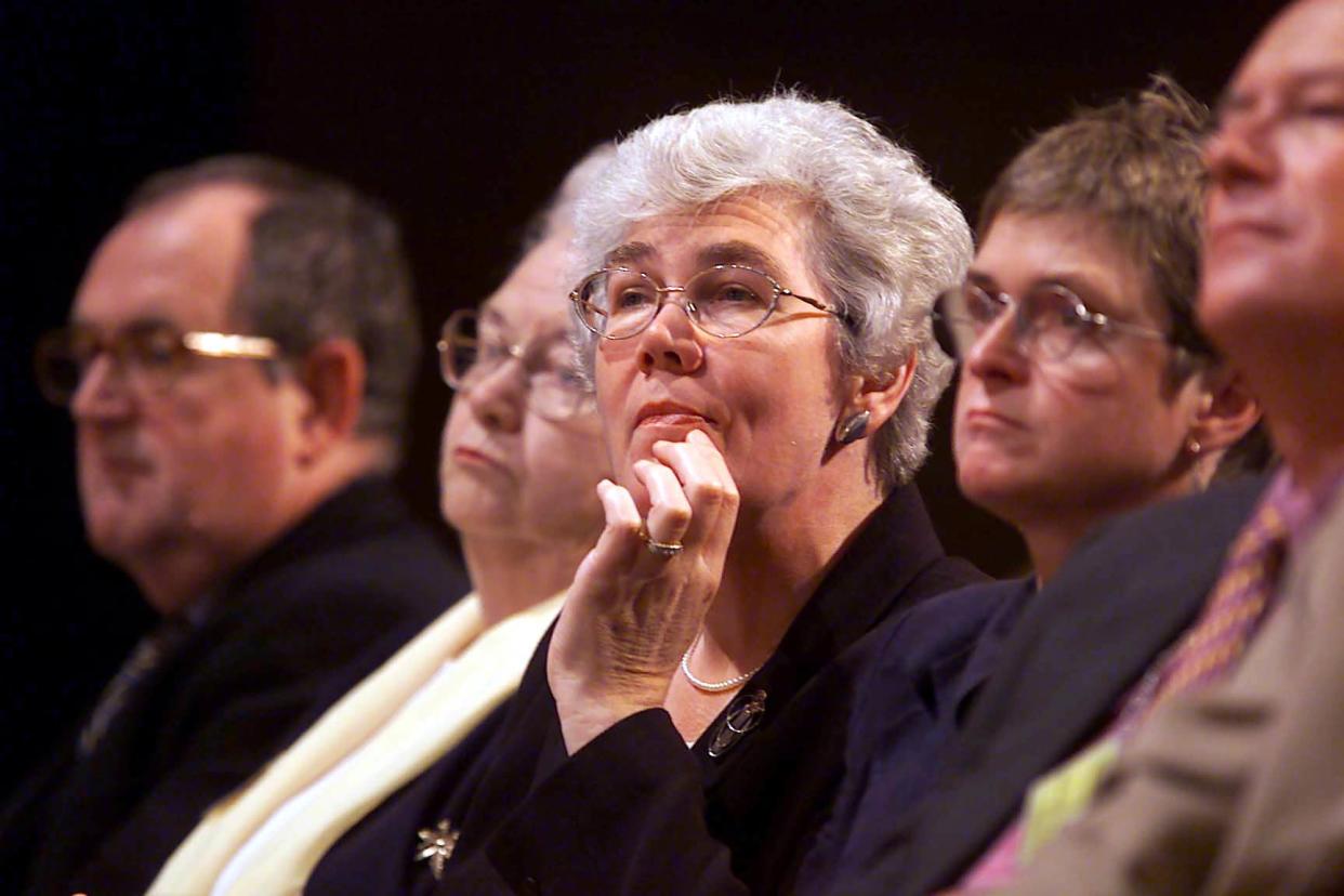 Departing Liberal Democrat President Baroness Diana Maddock (centre) listens to her successor Lord Navnit Dholakia addressing the Liberal Democrat Party Conference in Bournemouth: PA Archive