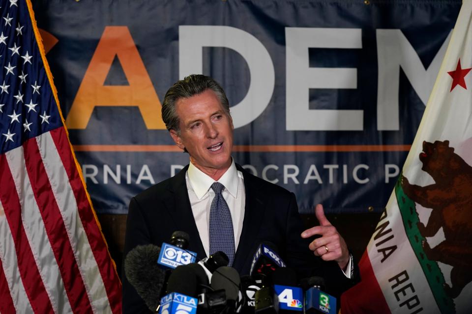 California Gov. Gavin Newsom addresses reporters after beating back the recall that aimed to remove him from office at the John L. Burton California Democratic Party headquarters in Sacramento, Calif., Tuesday, Sept. 14, 2021. (AP Photo/Rich Pedroncelli)