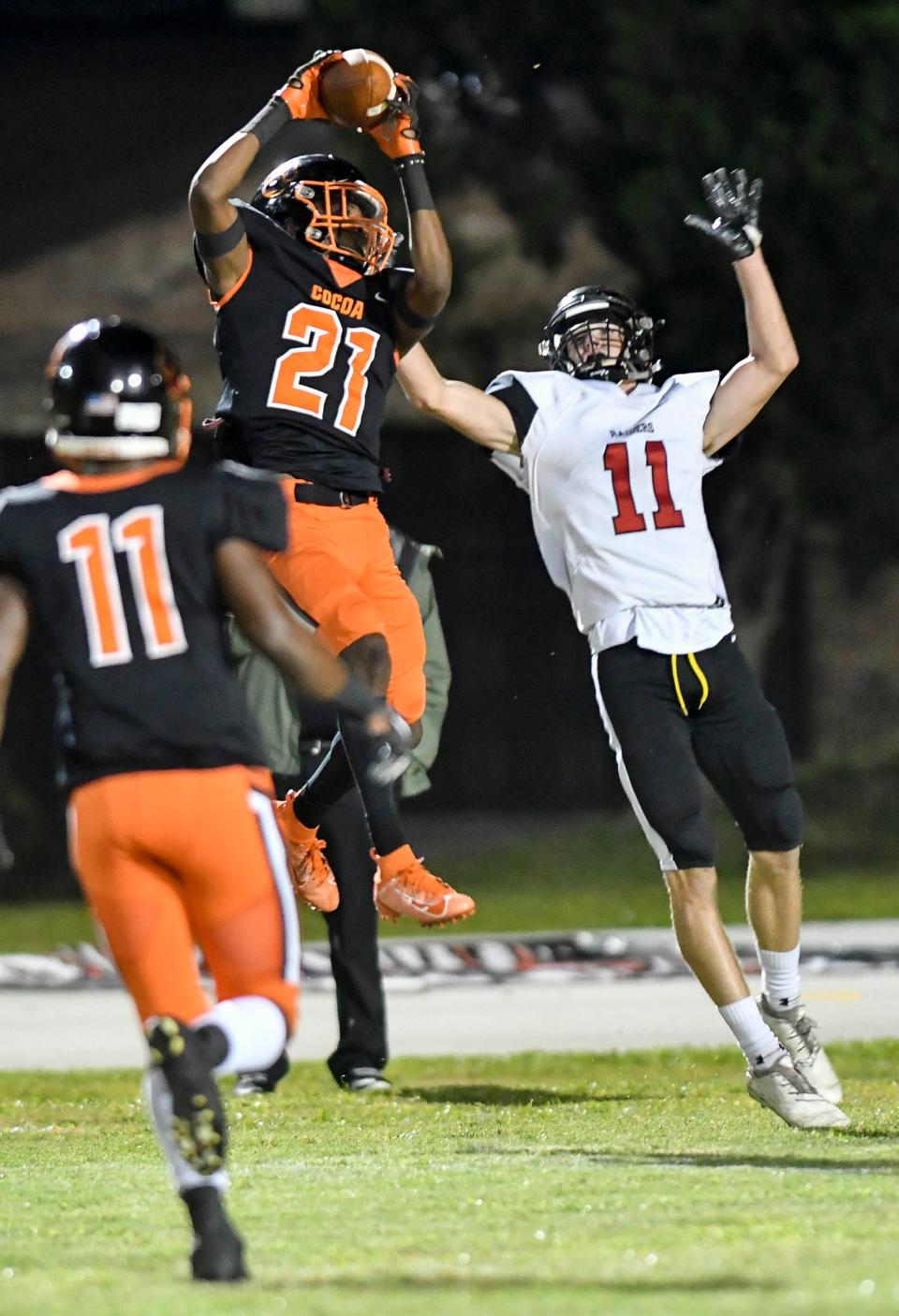 Cocoa's Cedric Hawkins intercepts a pass intended for Wyatt Mandahl of South Sumter in the FHSAA state football playoff regional finals.