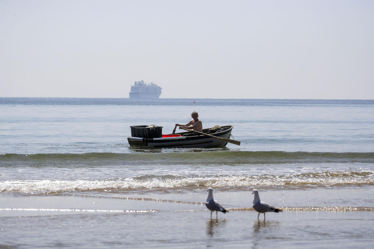 A man rows a boat on the Solent in Bournemouth, Dorset. Picture date: Monday April 19, 2021.